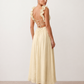 Woman wearing the Giedre Lace-Up A-Line Midi Dress featuring a deep V-neckline, ruffle shoulder sleeves, side waist cut-outs, adjustable lace-up open back and a flowing A-line midi skirt, ideal for weddings, race days and special occasions.