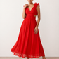 Woman wearing the Giedre Lace-Up A-Line Midi Dress featuring a deep V-neckline, ruffle shoulder sleeves, side waist cut-outs, adjustable lace-up open back and a flowing A-line midi skirt, ideal for weddings, race days and special occasions.