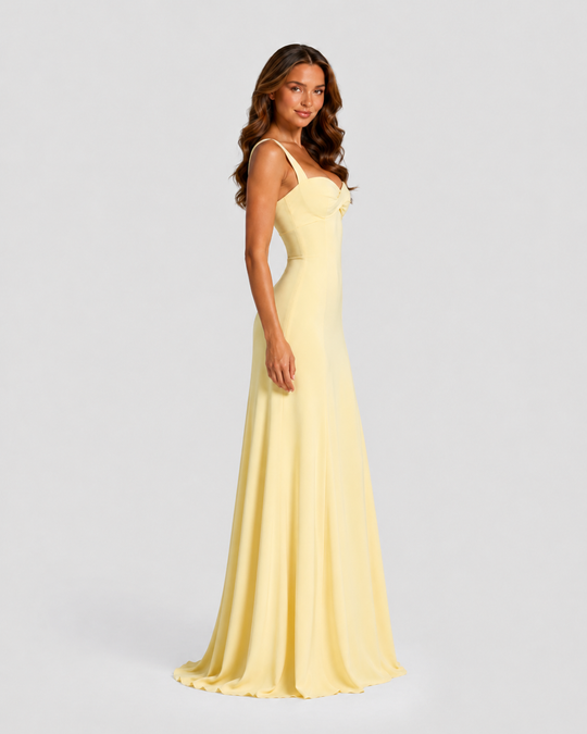 Women's chiffon maxi dress with sweetheart neckline, pleated underwired cups, fitted bodice, lace-up back, and flowing flared skirt for formal occasions.