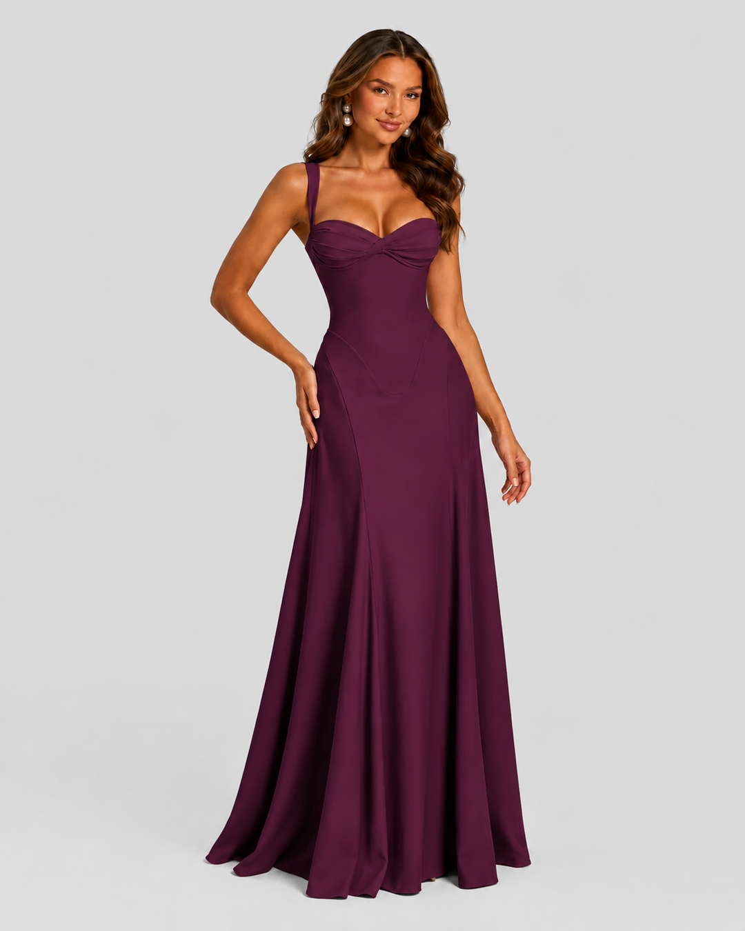 Women's chiffon maxi dress with sweetheart neckline, pleated underwired cups, fitted bodice, lace-up back, and flowing flared skirt for formal occasions.