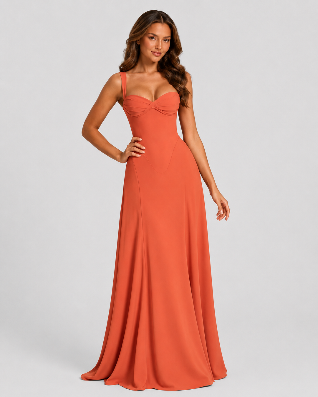 Women's chiffon maxi dress with sweetheart neckline, pleated underwired cups, fitted bodice, lace-up back, and flowing flared skirt for formal occasions.