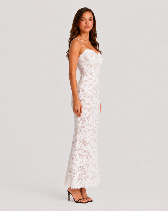 Women's floral embroidered maxi dress featuring scalloped trim, fitted bodice, lace-up back, and flowing skirt for elegant occasion wear.