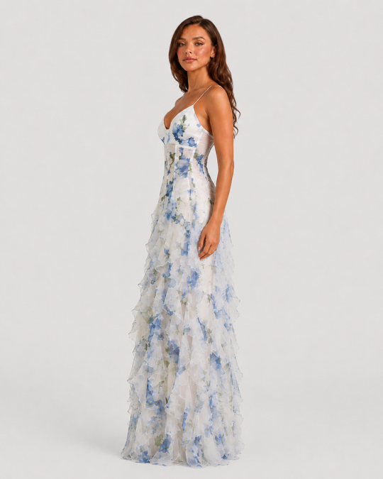 Women's floral ruffle maxi dress with corset-inspired bodice, adjustable straps, and flowing layered chiffon-look skirt in a feminine occasionwear silhouette.