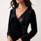 Women's Lidija sequined ruched mini dress with a wrap-style V-neckline, long sleeves, fitted silhouette, front ruching, asymmetric hem, and subtle front slit, ideal for parties, cocktail events, and festive occasions.