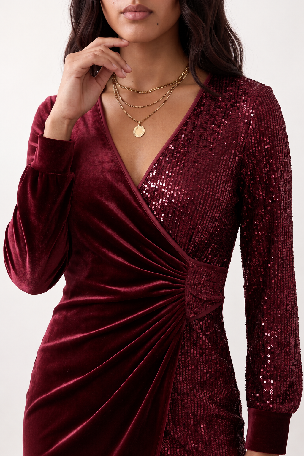 Women's Lidija sequined ruched mini dress with a wrap-style V-neckline, long sleeves, fitted silhouette, front ruching, asymmetric hem, and subtle front slit, ideal for parties, cocktail events, and festive occasions.