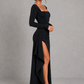 Women’s long sleeve stretch crepe maxi dress featuring a pleated waist, flared cuffs, fitted silhouette, and draped thigh-high split for evening and formal occasions.