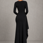 Women’s long sleeve stretch crepe maxi dress featuring a pleated waist, flared cuffs, fitted silhouette, and draped thigh-high split for evening and formal occasions.