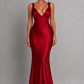 Women's satin maxi dress with a structured corset bodice, pleated cups, fan-shaped shoulder straps, adjustable lace-up back, and a flowing bias-cut skirt, designed for elegant evening occasions and formal events.