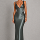 Women's satin maxi dress with a structured corset bodice, pleated cups, fan-shaped shoulder straps, adjustable lace-up back, and a flowing bias-cut skirt, designed for elegant evening occasions and formal events.
