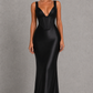 Women's satin maxi dress with a structured corset bodice, pleated cups, fan-shaped shoulder straps, adjustable lace-up back, and a flowing bias-cut skirt, designed for elegant evening occasions and formal events.