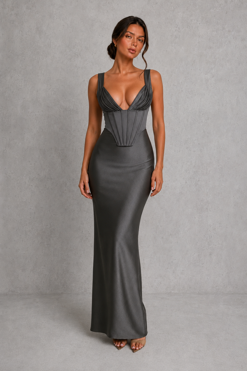 Women's satin maxi dress with a structured corset bodice, pleated cups, fan-shaped shoulder straps, adjustable lace-up back, and a flowing bias-cut skirt, designed for elegant evening occasions and formal events.