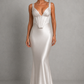 Women's satin maxi dress with a structured corset bodice, pleated cups, fan-shaped shoulder straps, adjustable lace-up back, and a flowing bias-cut skirt, designed for elegant evening occasions and formal events.