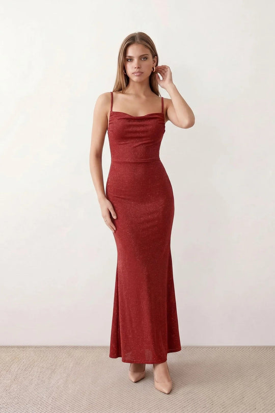 Woman wearing the metallic cowl neck mermaid maxi dress with adjustable spaghetti straps, a ruched bodice, low open back, and shimmering figure-hugging silhouette, perfect for weddings, black-tie events, proms, and formal evening occasions.