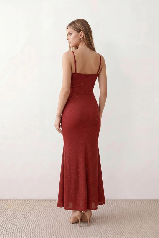 Woman wearing the metallic cowl neck mermaid maxi dress with adjustable spaghetti straps, a ruched bodice, low open back, and shimmering figure-hugging silhouette, perfect for weddings, black-tie events, proms, and formal evening occasions.