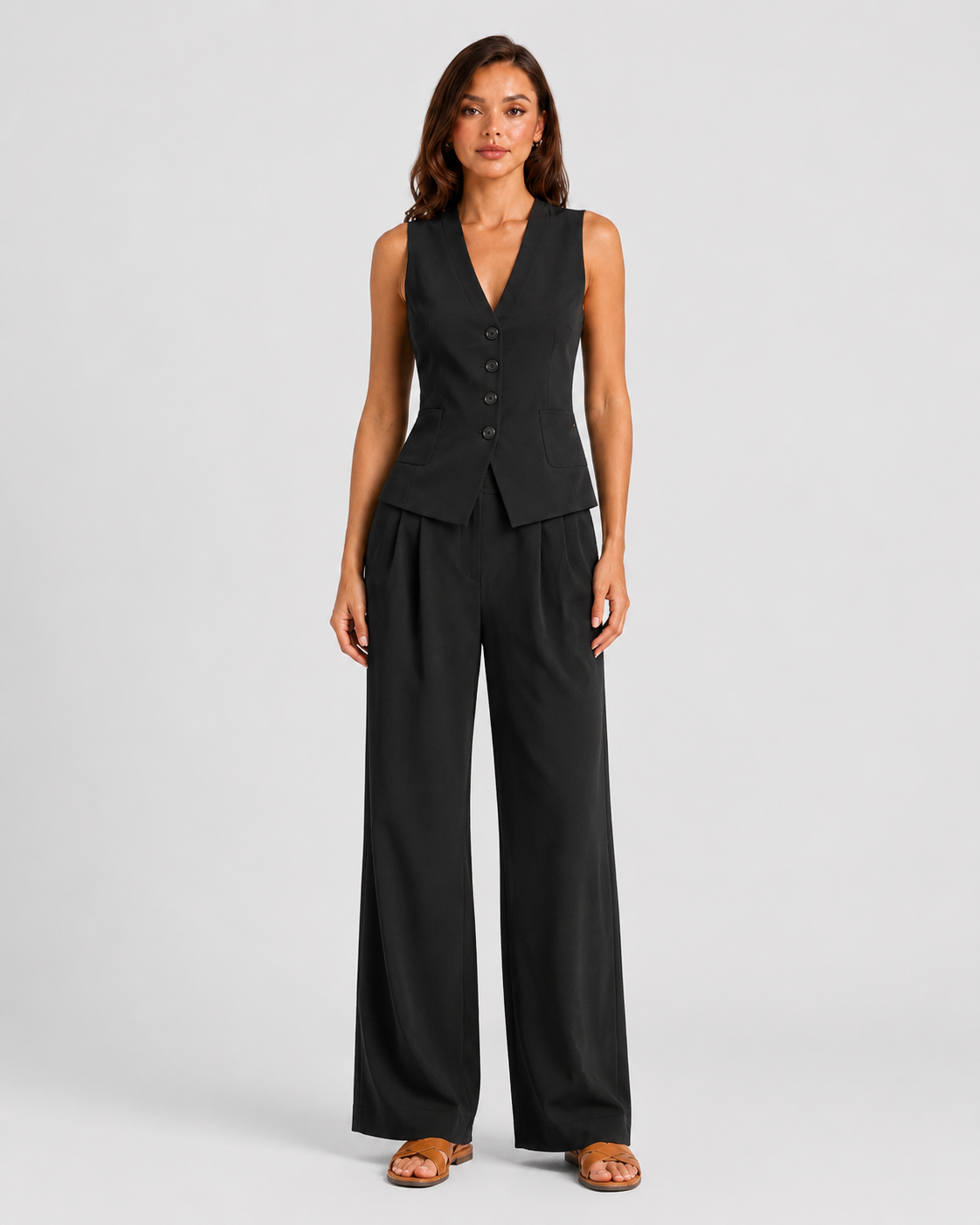 Women's sleeveless tailored waistcoat and wide-leg trousers co-ord set in breathable linen-look fabric with button-front detail and relaxed tailored fit.