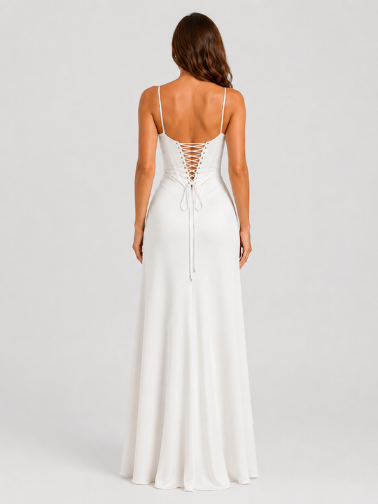 Woman wearing an elegant bustier maxi gown with delicate straps, fitted bodice, and flowing full-length skirt designed for formal occasions.