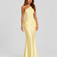 Woman wearing a one-shoulder satin maxi dress with a fitted stretch crepe bodice, asymmetric dropped waist, and elegant draped hip detailing.