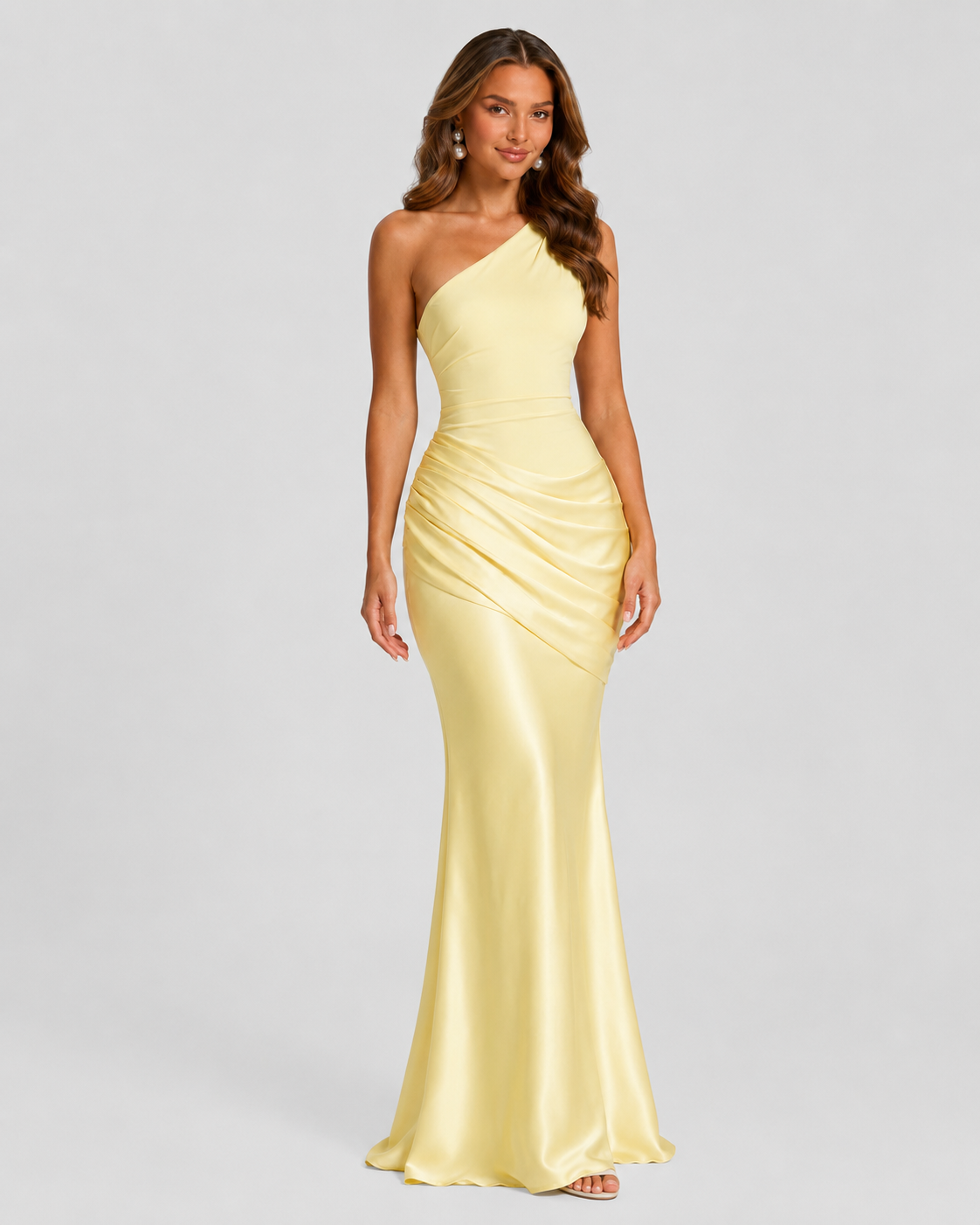 Woman wearing a one-shoulder satin maxi dress with a fitted stretch crepe bodice, asymmetric dropped waist, and elegant draped hip detailing.
