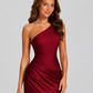 Woman wearing a one-shoulder satin maxi dress with a fitted stretch crepe bodice, asymmetric dropped waist, and elegant draped hip detailing.