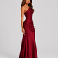 Woman wearing a one-shoulder satin maxi dress with a fitted stretch crepe bodice, asymmetric dropped waist, and elegant draped hip detailing.