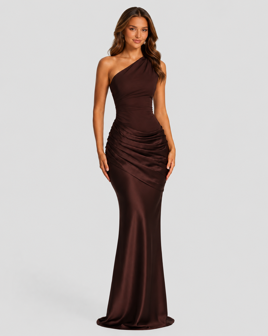 Woman wearing a one-shoulder satin maxi dress with a fitted stretch crepe bodice, asymmetric dropped waist, and elegant draped hip detailing.