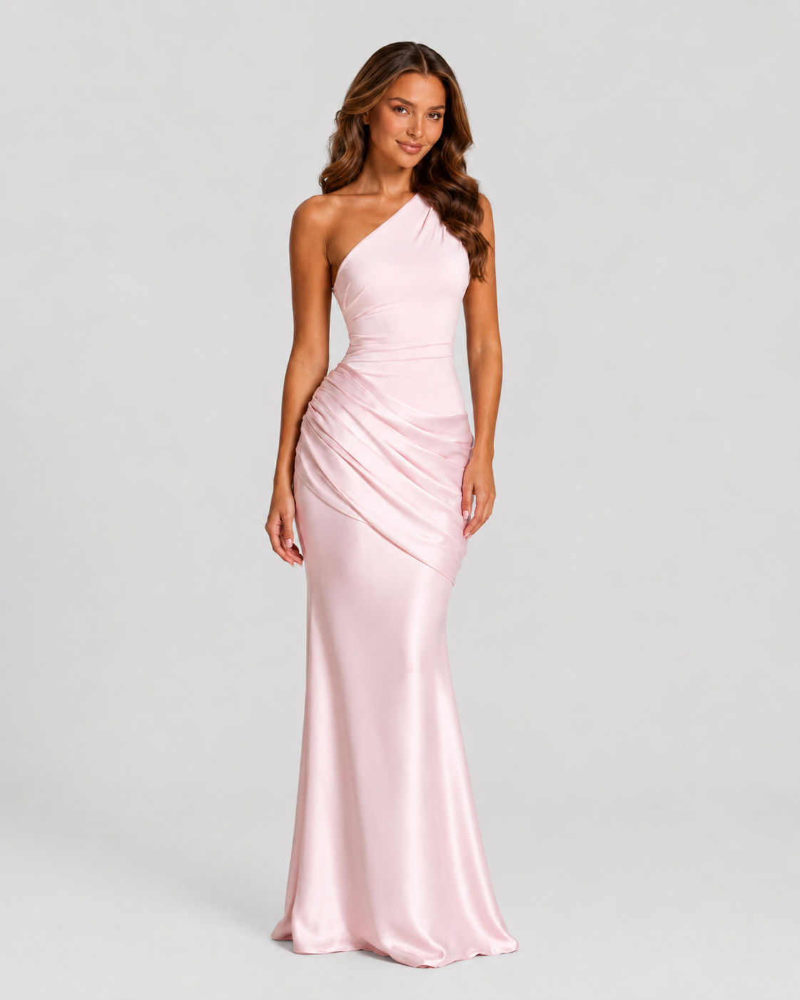 Woman wearing a one-shoulder satin maxi dress with a fitted stretch crepe bodice, asymmetric dropped waist, and elegant draped hip detailing.