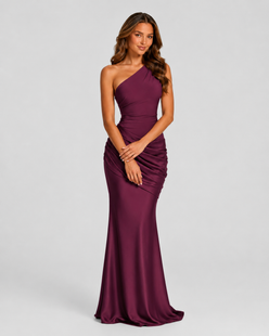 Woman wearing a one-shoulder satin maxi dress with a fitted stretch crepe bodice, asymmetric dropped waist, and elegant draped hip detailing.