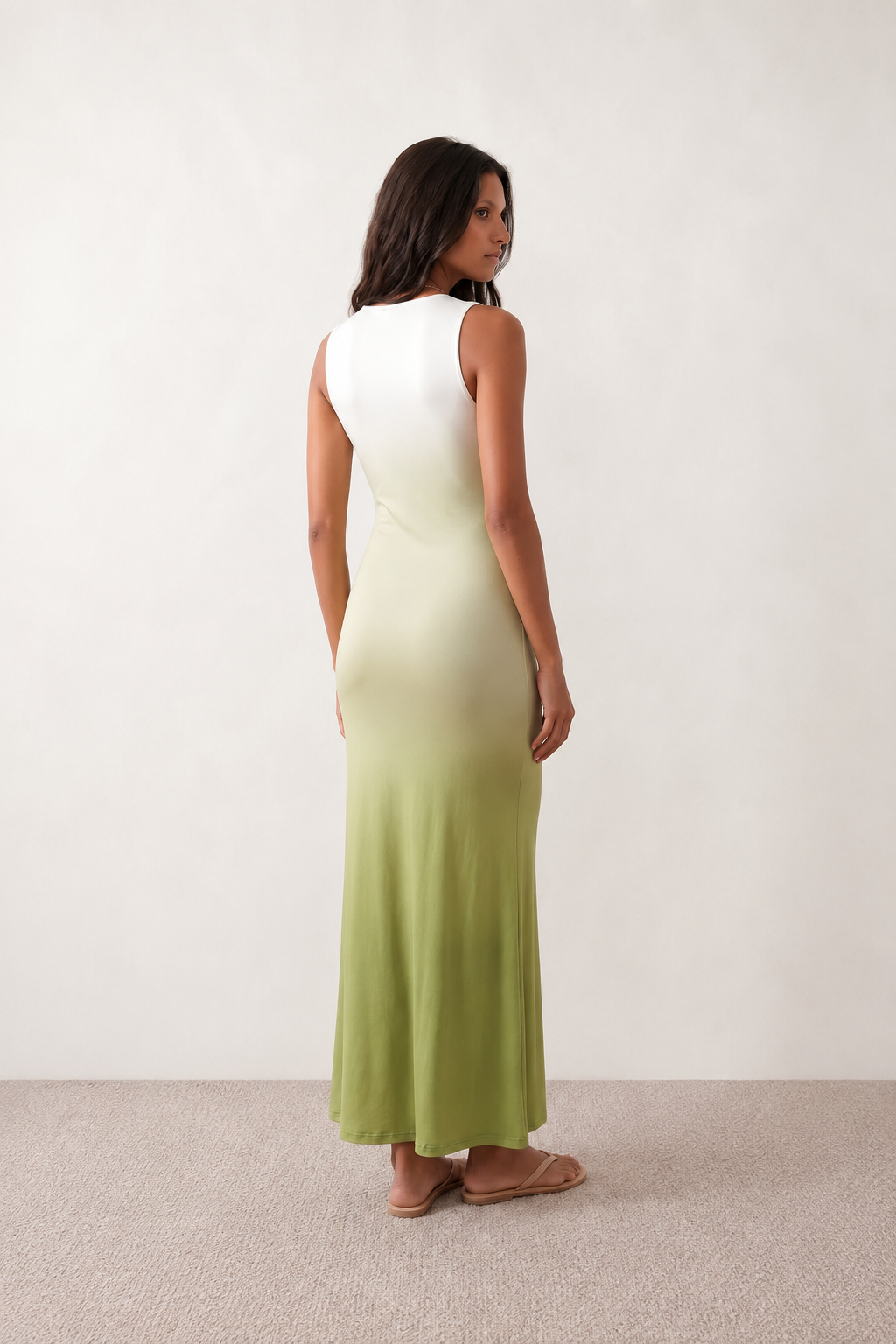 Women's Ariana plunge neck fitted maxi dress in a white-to-sage green ombré gradient, featuring a deep V neckline, twist-front knot waist, ruched bodice, sleeveless bodycon silhouette, mermaid hem, and concealed back zip. An elegant evening gown perfect for weddings, black-tie events, proms, and formal occasions.