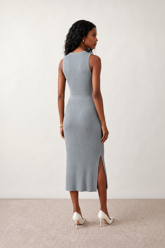 Woman wearing the Raina ribbed fitted midi dress in a sleeveless bodycon design with a round neckline, wide-rib knit texture and elegant side slit, styled as a sophisticated occasion dress.