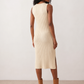 Woman wearing the Raina ribbed fitted midi dress in a sleeveless bodycon design with a round neckline, wide-rib knit texture and elegant side slit, styled as a sophisticated occasion dress.