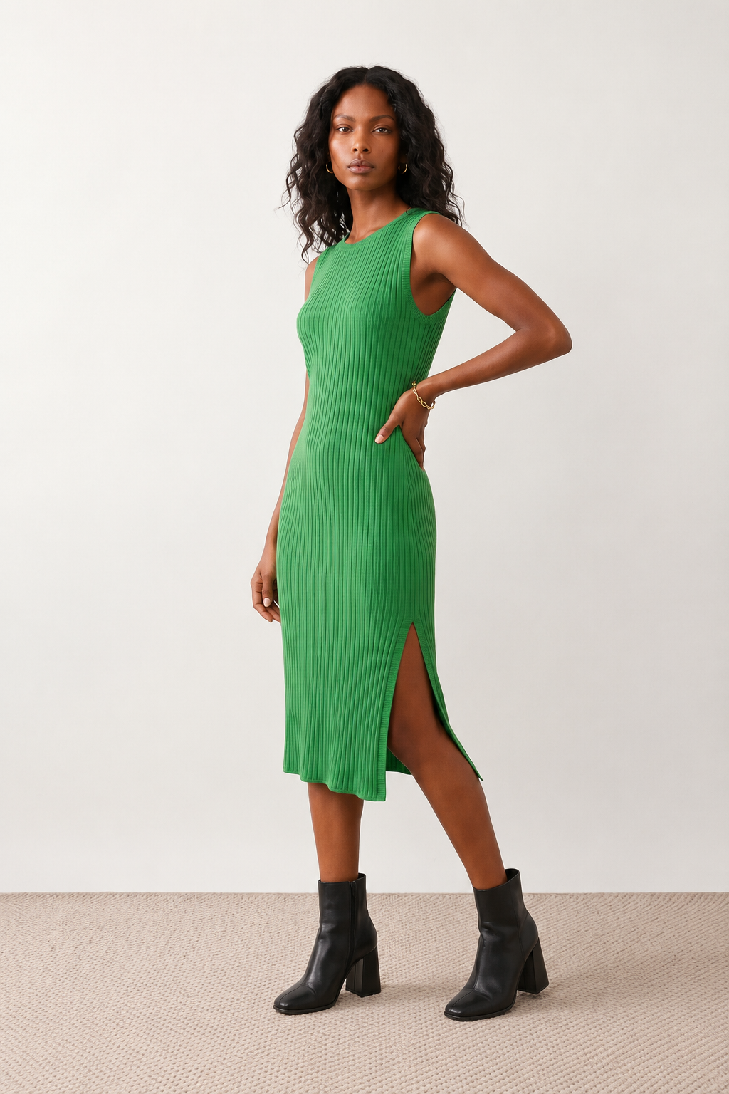 Woman wearing the Raina ribbed fitted midi dress in a sleeveless bodycon design with a round neckline, wide-rib knit texture and elegant side slit, styled as a sophisticated occasion dress.