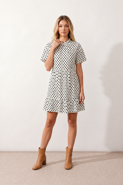 Women's Romy Polka Dot Ruffle Detail Mini Dress in lightweight woven chiffon featuring an all-over polka dot print, ruffled mock neckline, flutter sleeves, defined waist and tiered ruffle mini skirt, ideal for weddings, garden parties and elegant occasion wear.
