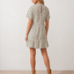 Women's Romy Polka Dot Ruffle Detail Mini Dress in lightweight woven chiffon featuring an all-over polka dot print, ruffled mock neckline, flutter sleeves, defined waist and tiered ruffle mini skirt, ideal for weddings, garden parties and elegant occasion wear.