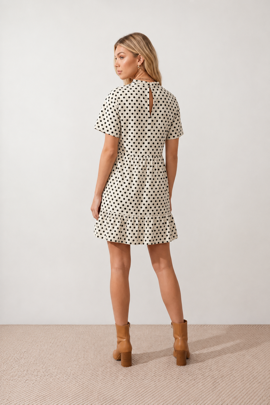 Women's Romy Polka Dot Ruffle Detail Mini Dress in lightweight woven chiffon featuring an all-over polka dot print, ruffled mock neckline, flutter sleeves, defined waist and tiered ruffle mini skirt, ideal for weddings, garden parties and elegant occasion wear.