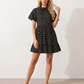 Women's Romy Polka Dot Ruffle Detail Mini Dress in lightweight woven chiffon featuring an all-over polka dot print, ruffled mock neckline, flutter sleeves, defined waist and tiered ruffle mini skirt, ideal for weddings, garden parties and elegant occasion wear.