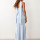 Woman wearing the Diana satin strapless maxi dress featuring a square neckline, scarf-style choker tie, open back with draped detail, and a floor-length fitted silhouette in a smooth satin finish.