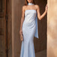 Woman wearing the Diana satin strapless maxi dress featuring a square neckline, scarf-style choker tie, open back with draped detail, and a floor-length fitted silhouette in a smooth satin finish.