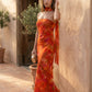 Woman wearing the Diana satin strapless maxi dress featuring a square neckline, scarf-style choker tie, open back with draped detail, and a floor-length fitted silhouette in a smooth satin finish.