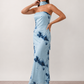 Woman wearing the Diana satin strapless maxi dress featuring a square neckline, scarf-style choker tie, open back with draped detail, and a floor-length fitted silhouette in a smooth satin finish.