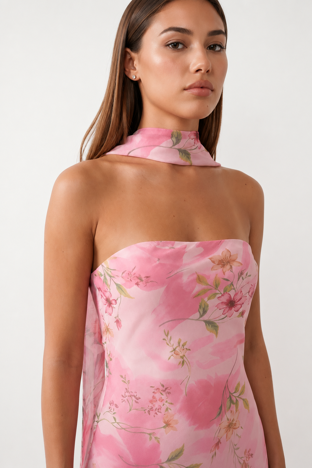 Woman wearing the Diana satin strapless maxi dress featuring a square neckline, scarf-style choker tie, open back with draped detail, and a floor-length fitted silhouette in a smooth satin finish.