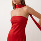 Woman wearing the Diana satin strapless maxi dress featuring a square neckline, scarf-style choker tie, open back with draped detail, and a floor-length fitted silhouette in a smooth satin finish.