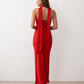 Woman wearing the Diana satin strapless maxi dress featuring a square neckline, scarf-style choker tie, open back with draped detail, and a floor-length fitted silhouette in a smooth satin finish.