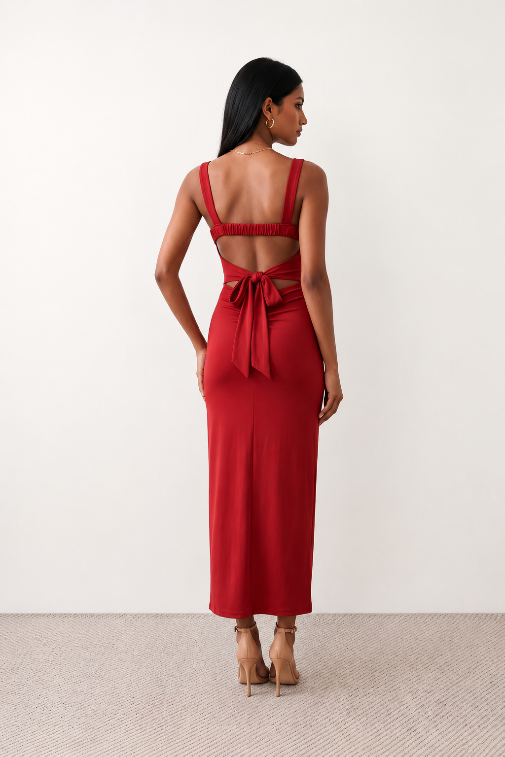 Woman wearing the Skye Open Back Fitted Maxi Dress featuring a square neckline, wide shoulder straps, ruched bodycon silhouette, open back with a smocked panel and tie-bow fastening, thigh-high side split, and floor-length maxi design, perfect for weddings, cocktail parties and formal occasions.