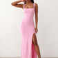 Woman wearing the Skye Open Back Fitted Maxi Dress featuring a square neckline, wide shoulder straps, ruched bodycon silhouette, open back with a smocked panel and tie-bow fastening, thigh-high side split, and floor-length maxi design, perfect for weddings, cocktail parties and formal occasions.