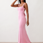 Woman wearing the Skye Open Back Fitted Maxi Dress featuring a square neckline, wide shoulder straps, ruched bodycon silhouette, open back with a smocked panel and tie-bow fastening, thigh-high side split, and floor-length maxi design, perfect for weddings, cocktail parties and formal occasions.
