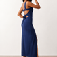 Woman wearing the Skye Open Back Fitted Maxi Dress featuring a square neckline, wide shoulder straps, ruched bodycon silhouette, open back with a smocked panel and tie-bow fastening, thigh-high side split, and floor-length maxi design, perfect for weddings, cocktail parties and formal occasions.