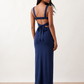 Woman wearing the Skye Open Back Fitted Maxi Dress featuring a square neckline, wide shoulder straps, ruched bodycon silhouette, open back with a smocked panel and tie-bow fastening, thigh-high side split, and floor-length maxi design, perfect for weddings, cocktail parties and formal occasions.