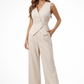 Woman wearing a beige jumpsuit on a white background