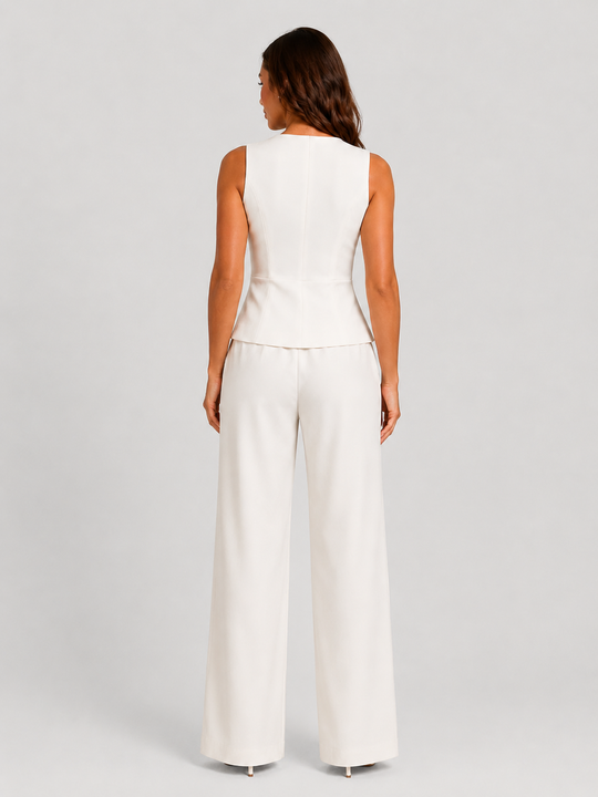 Woman wearing a sleeveless tailored waistcoat with high-waisted wide-leg trousers in a coordinated two-piece set, featuring a relaxed elegant silhouette and modern tailoring.
