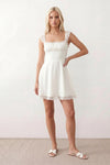 Women's Soraia Lace Lace-Up Mini Dress featuring elegant floral lace, a square neckline with a ruched bust, scalloped cap sleeves, a corset-style lace-up back, and a flattering A-line mini skirt finished with a scalloped lace hem, perfect for weddings, race days, garden parties and special occasions.